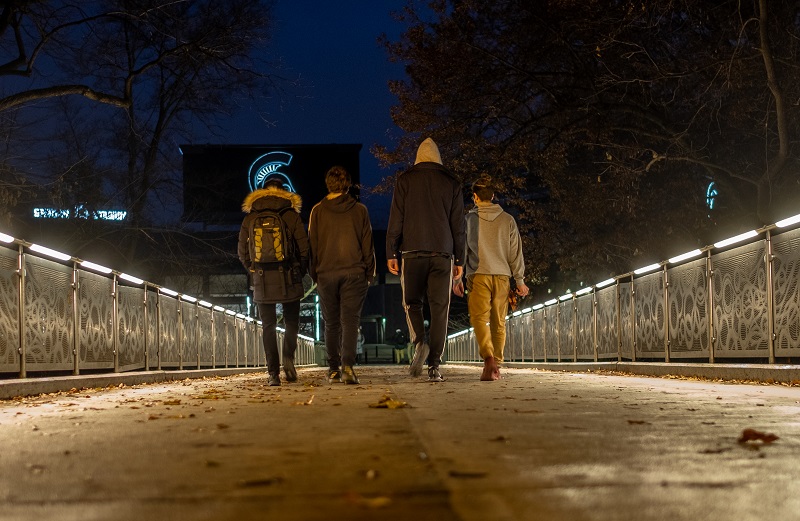 Students walking on bridge